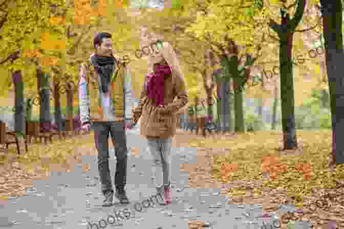 Image Of A Couple Walking Hand In Hand Through A Park In Autumn, Surrounded By Golden Leaves. The Reason For The Seasons